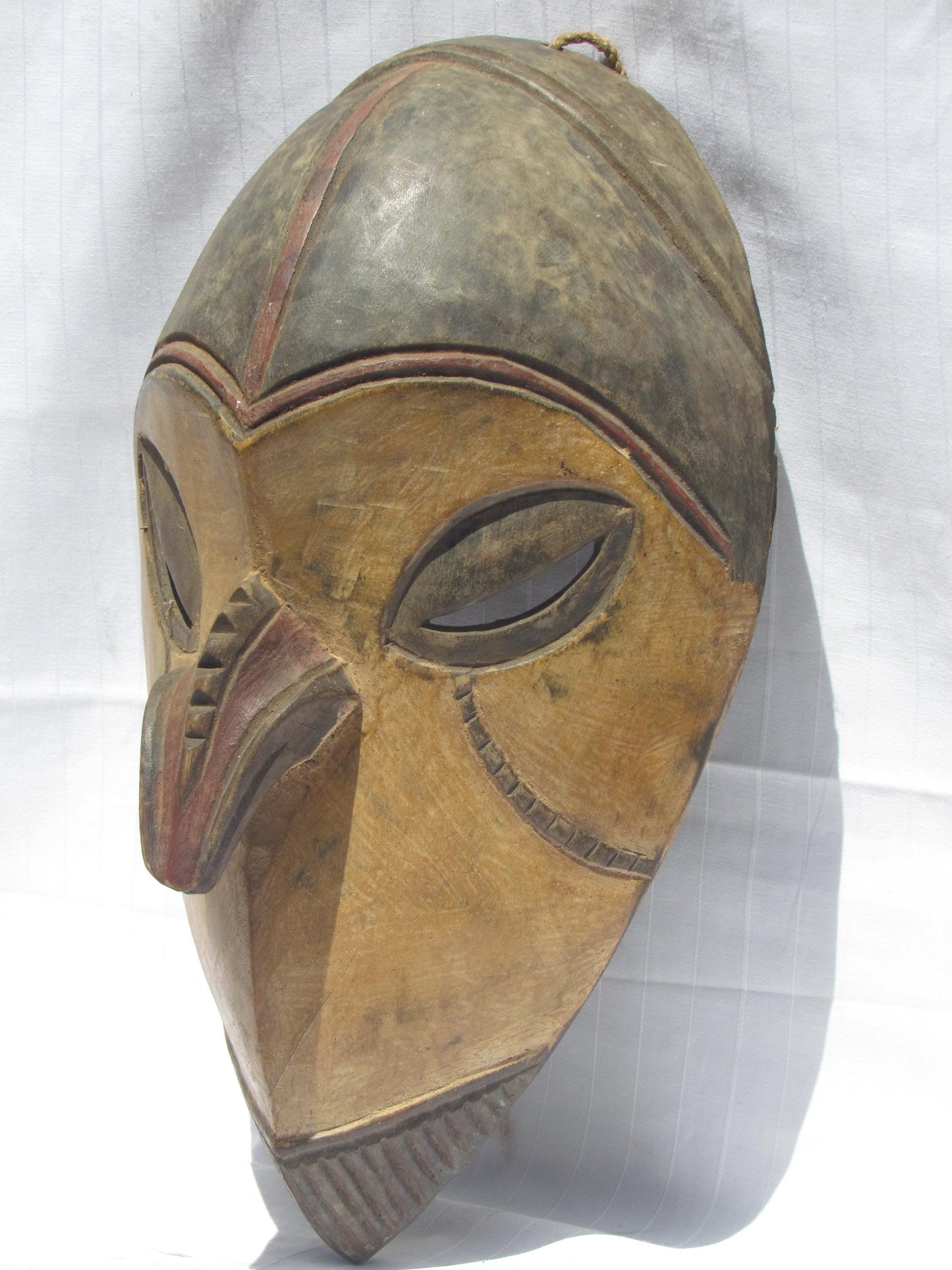 Vintage hand carved wall hanging African traditional wooden mask with a long nose from D.R.C.