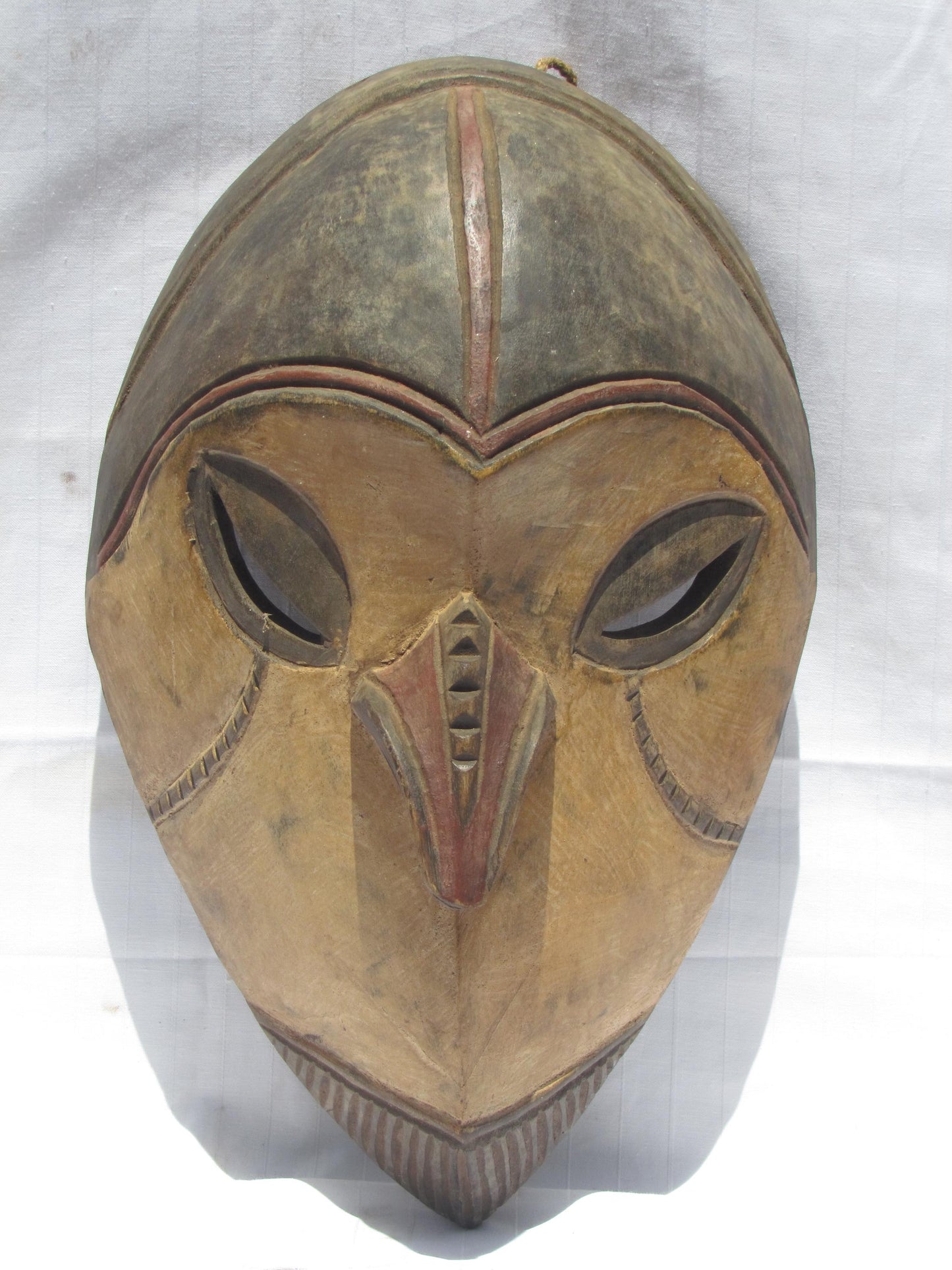 Vintage hand carved wall hanging African traditional wooden mask with a long nose from D.R.C.
