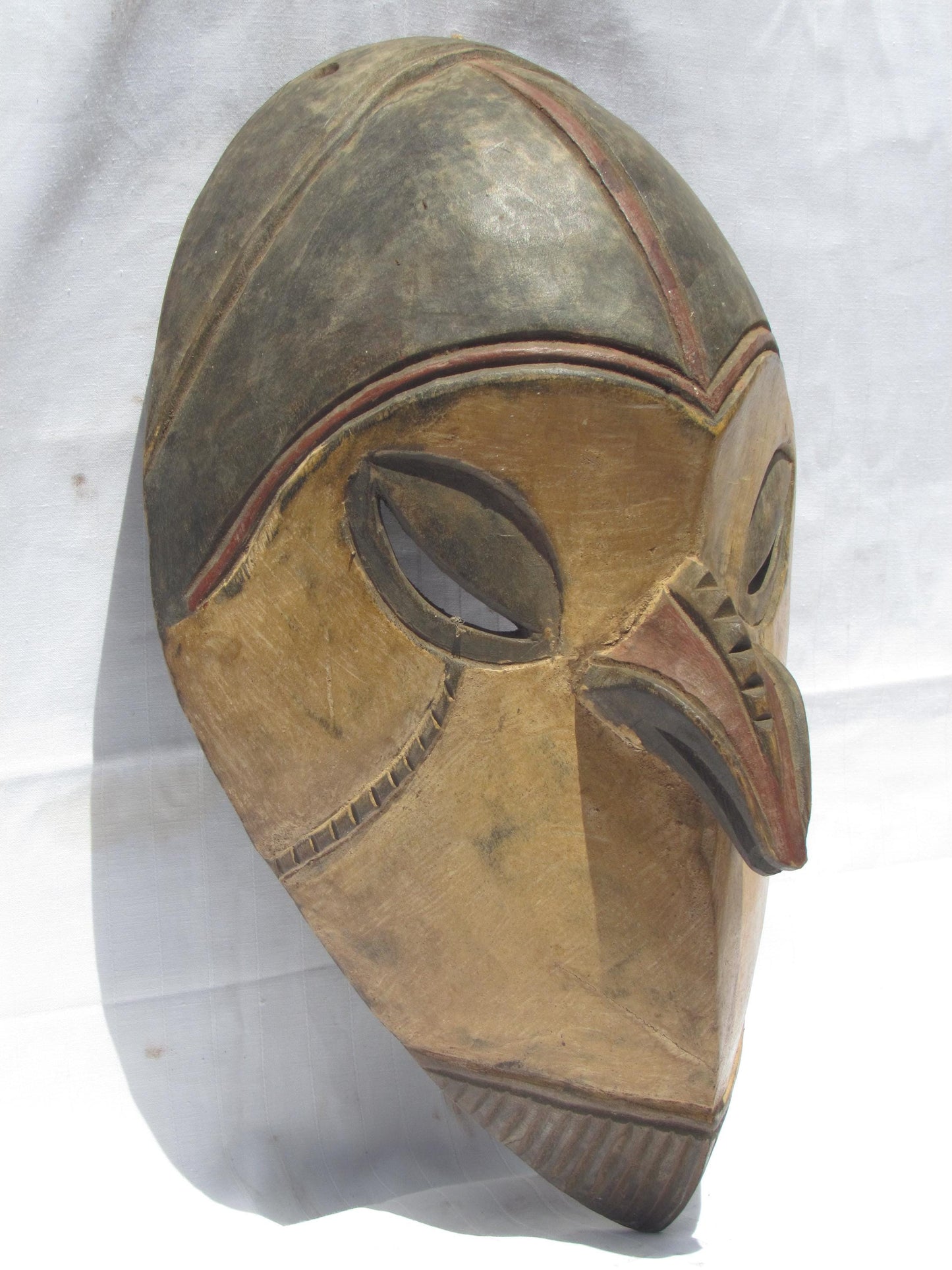 Vintage hand carved wall hanging African traditional wooden mask with a long nose from D.R.C.