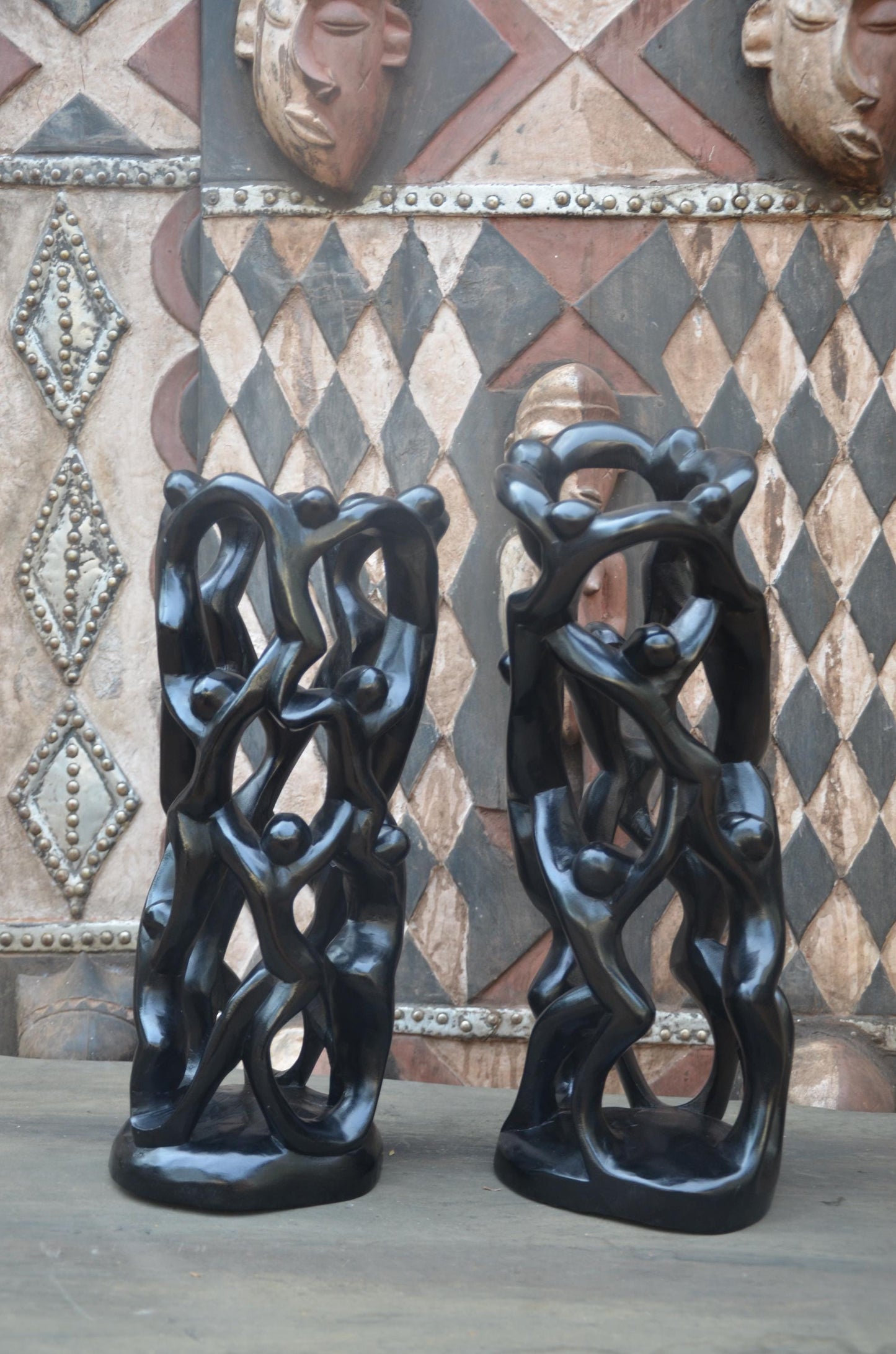 Matching Pair of Hand-Carved African "Circle of Unity" Sculptures