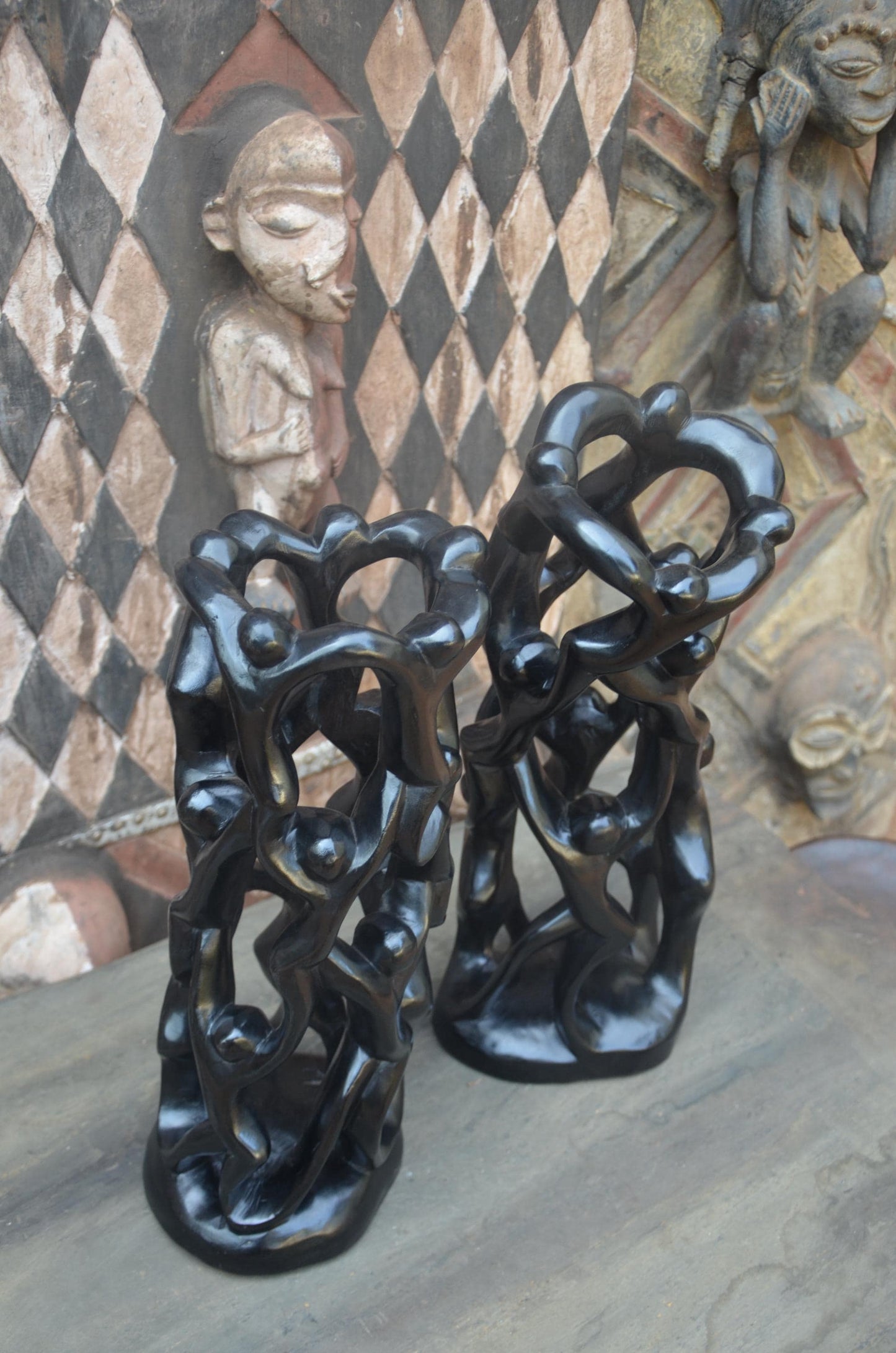 Matching Pair of Hand-Carved African "Circle of Unity" Sculptures