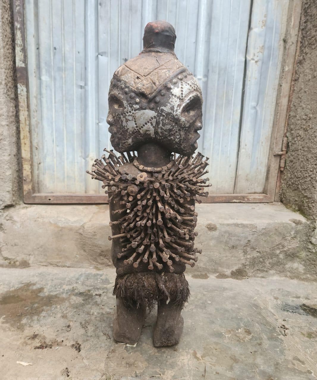 African Multi-faced Nkisi – Four-Faced Wood Congo Nail Power Statue Art