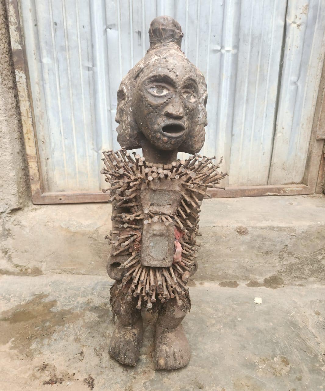 African Multi-faced Nkisi – Four-Faced Wood Congo Nail Power Statue Art