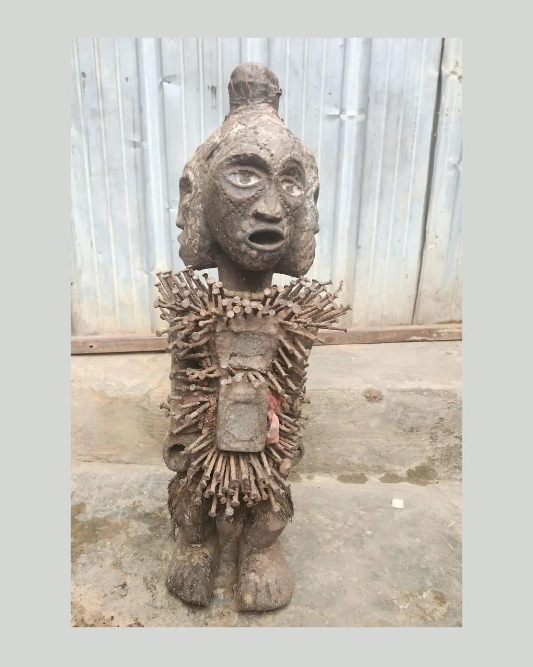 African Multi-faced Nkisi – Four-Faced Wood Congo Nail Power Statue Art