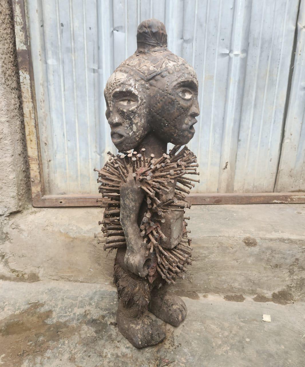 African Multi-faced Nkisi – Four-Faced Wood Congo Nail Power Statue Art