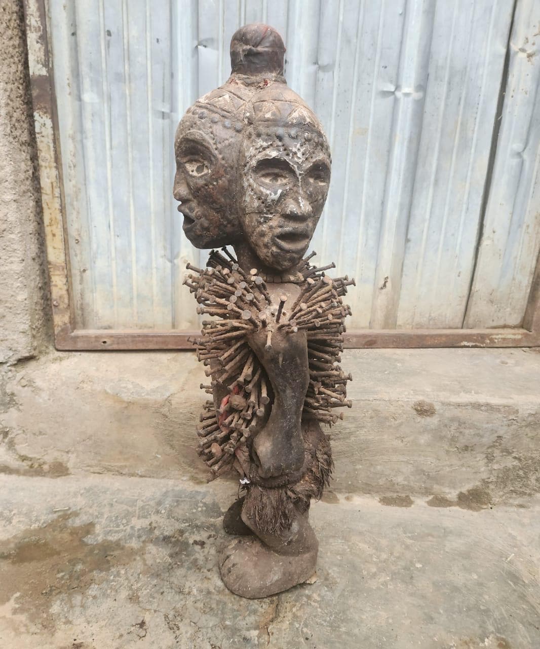 African Multi-faced Nkisi – Four-Faced Wood Congo Nail Power Statue Art